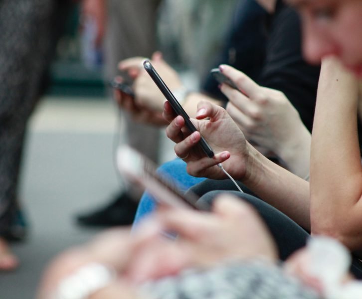 A crowd of people on their phones