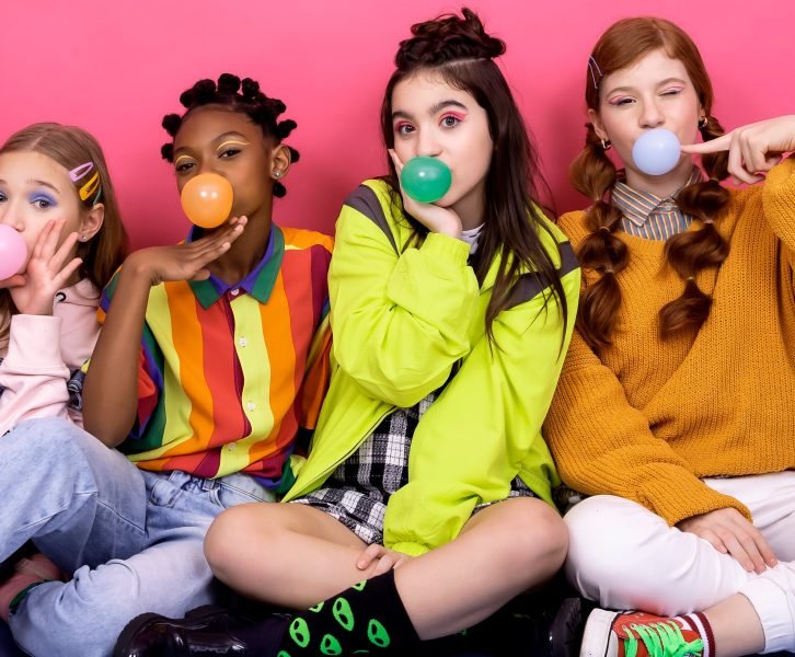 teen girls blowing bubblegum