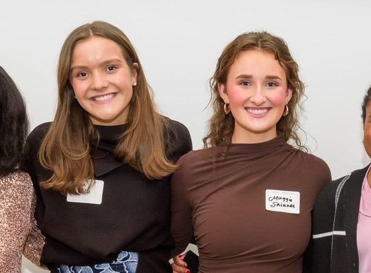 Photo of four young women smiling and standing together in a group, with a sign above them that reads "Meet the Springboarders." The image is related to a Teen Advisory Board.