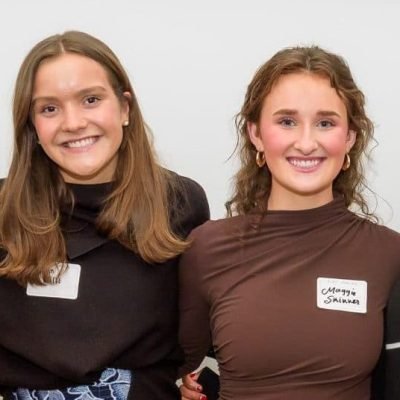 Photo of four young women smiling and standing together in a group, with a sign above them that reads "Meet the Springboarders." The image is related to a Teen Advisory Board.